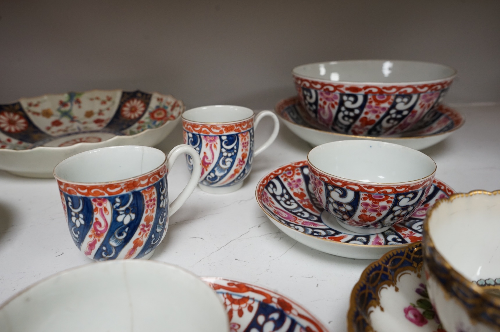 A Worcester Lord Henry Thynne type fluted tea bowl and saucer, c.1780, a group of Worcester Queen Charlotte pattern tea and coffee wares, c.1790-1810, two Worcester Kakiemon style dishes, largest 21cm in diameter